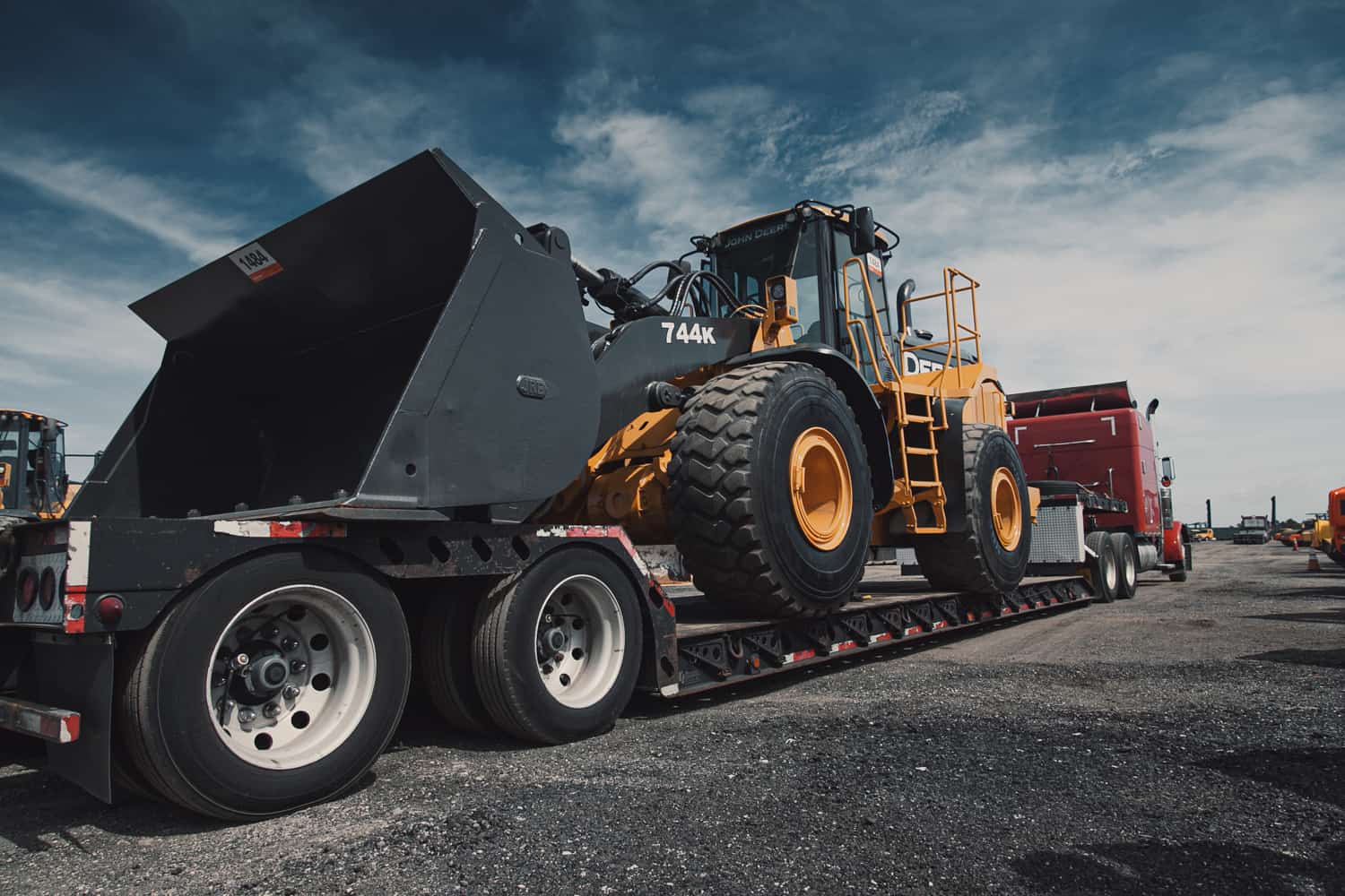 A lowboy trailer hauling a wheel loader