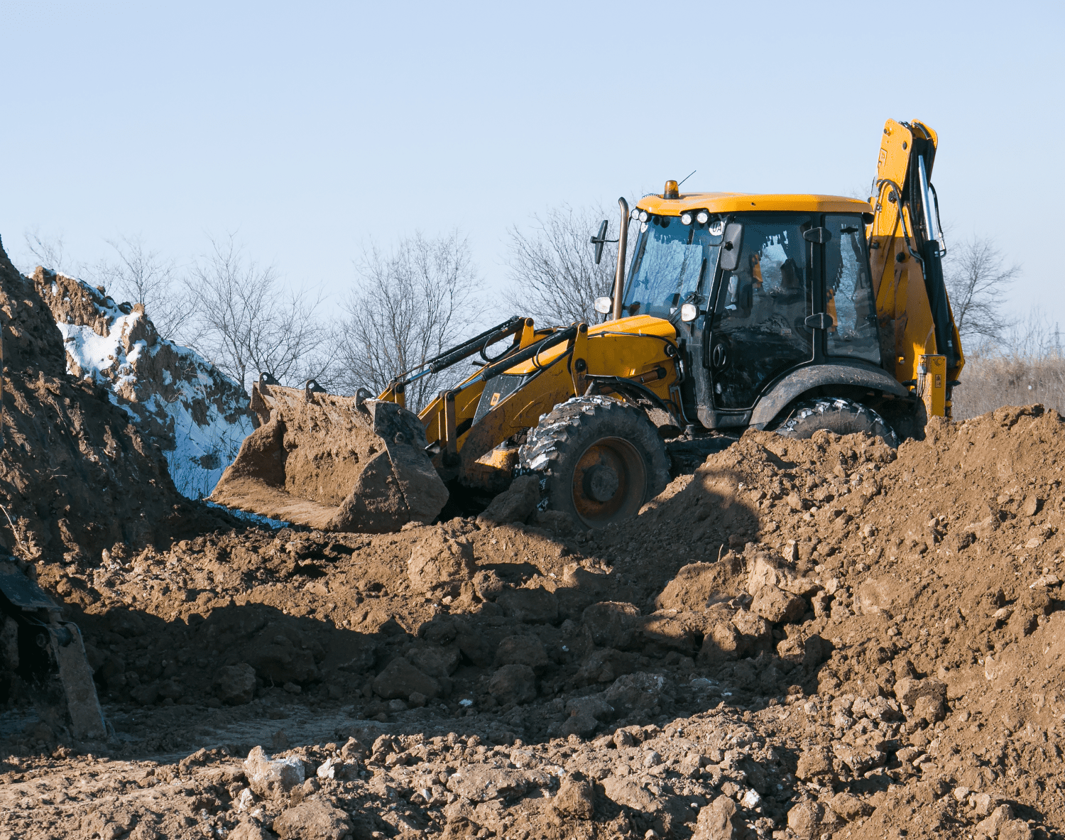 backhoe in the dirt