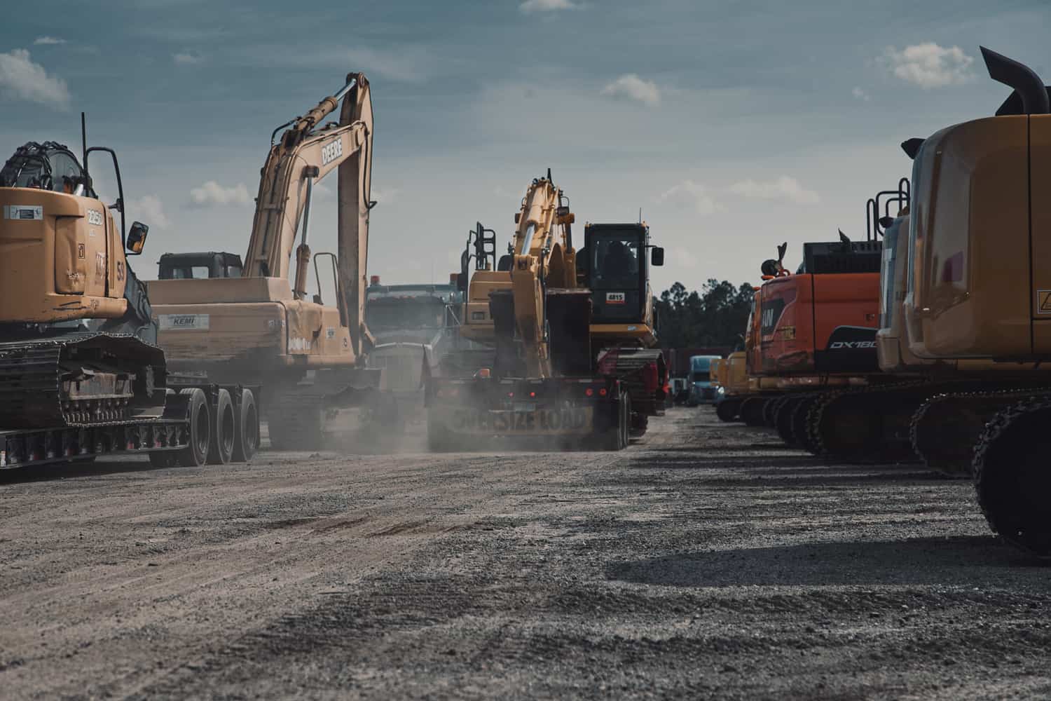 excavators being transported