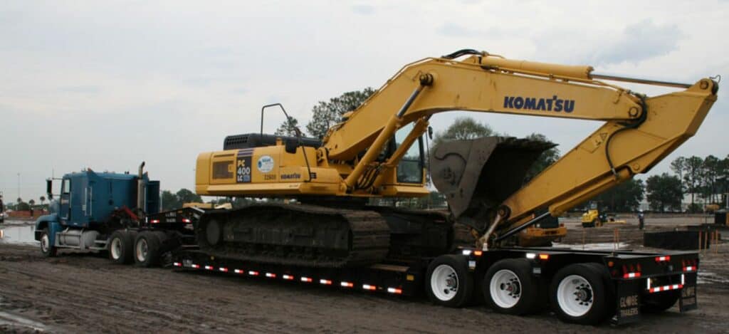 lowboy trailer with excavator