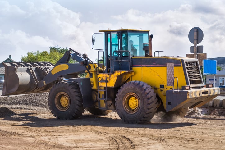 Yellow Wheel Loader building machine with blue sky